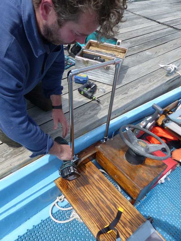 Sean Ryan installing grip rail on Boston Whaler, Robinhood, Maine