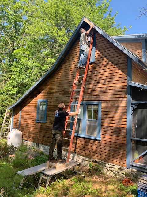 Sean Ryan and Charlie working on the cottage