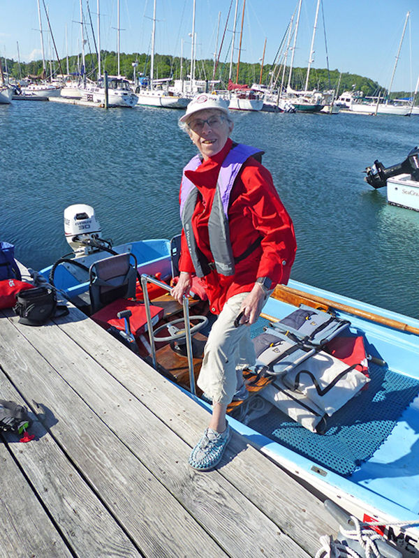 Judy disembarking Boston Whaler using new grip rail