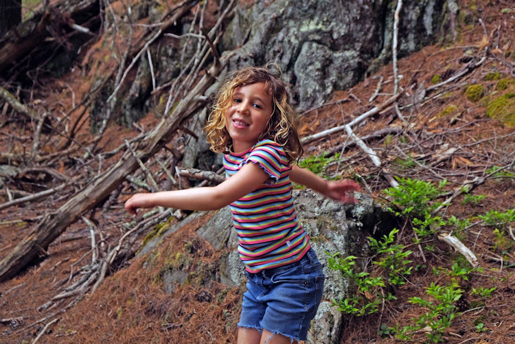 Lucie whirling along trail by Clarey Pond, Robinhood Farm
