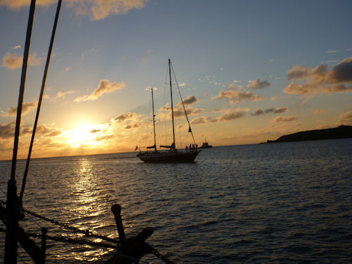 another sailboat at sunset